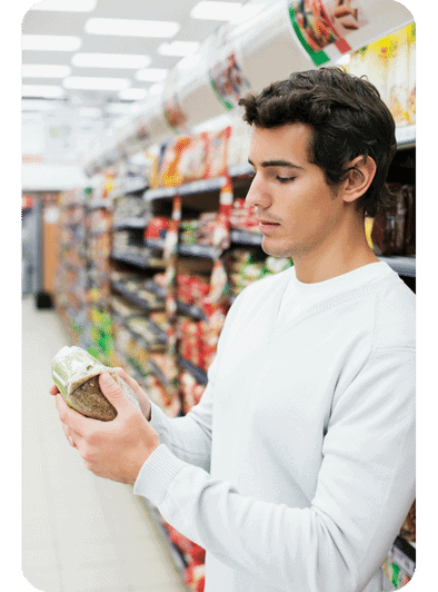 man looking at food product label